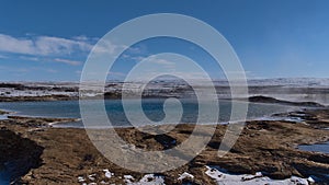 Hot water pool of The Great Geysir, name giver for all geysers worldwide, in Geysir in Haukadalur, Golden Circle, Iceland.