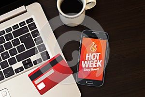 Hot Week advertising on smartphone. photo