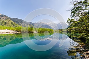 Hotaka mountain reflect on taisho pond at kamikochi japan