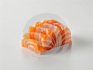 Hotate Sushi Roll and salmon and otoro sashimi with a white backdrop. Sushi with salmon and cucumber on a plate.?