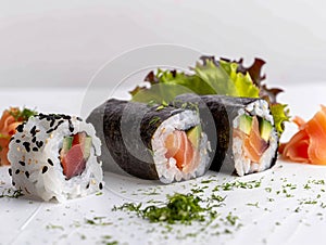 Hotate Sushi Roll and salmon and otoro sashimi with a white backdrop. Sushi with salmon and cucumber on a plate.?
