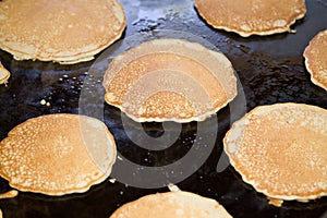 Hotcakes on a griddle photo