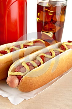 Hotdogs for dinner with coca-cola on wood