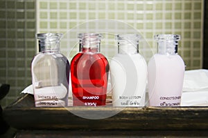 Hotel amenities kit spa, soap and shampoo in vintage bathroom