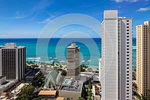 The hotel architecture with the iconic Waikiki beach in the back