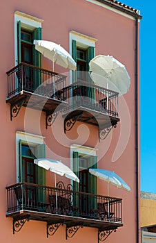 Hotel balconies with umbrellas