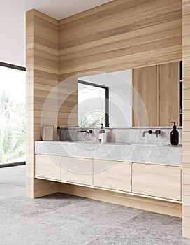 Hotel bathroom interior with double sink and accessories, panoramic window