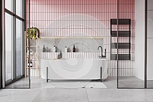 Hotel bathroom interior with tub near panoramic window