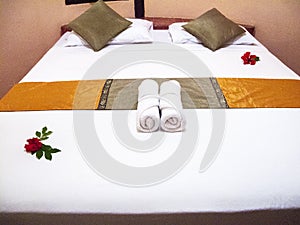 Hotel bed with white linen