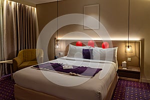 Hotel bedroom classic style interior, romantic night atmosphere