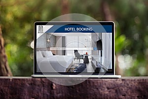 Hotel booking on internet, online reservation on the screen of laptop / computer