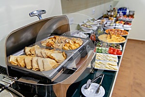 Hotel breakfast catering setting at the hotel, with variety of pancakes in marmite photo
