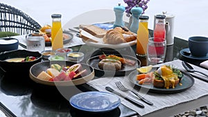 Hotel breakfast with fresh benedict eggs, salmon, fruits and freshly juices