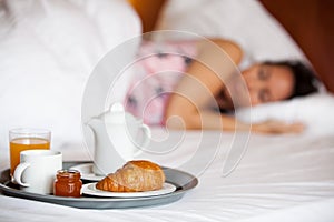 Hotel breakfast and a sleeping woman
