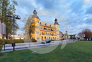 Hotel castle in Velden at Worthersee in early morning photo