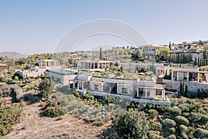 Hotel complex with colonnades on a hill. Amanzoe, Peloponnese, Greece. Drone photo