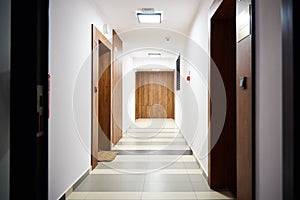 Hotel corridor with living room doors. Modern residential complex