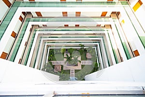 Hotel courtyard with grass lawn and balcony