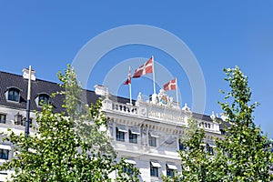 Hotel D'Angleterre in Copenhagen with Danish flags.