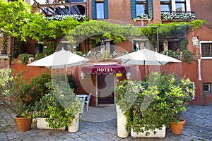 Hotel entrance with green plants