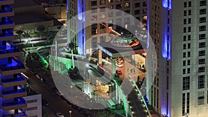 Hotel entrance view in Dubai marina at night from top of skyscraper timelapse