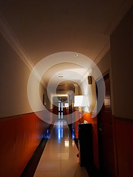 the hotel hallway with a little light looks calm and eerie