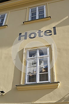 Hotel lettering on the facade of a hotel in Prague
