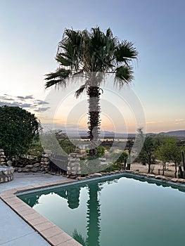 Hotel outdoors swimming pool in Africa. Sunset or sunrise.