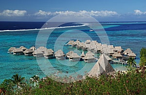 Hotel over the turquoise lagoon in Bora Bora photo