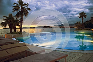 Hotel pool on sunset near Split