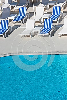 Hotel Poolside Chairs near a swimming pool