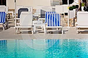 Hotel Poolside Chairs near a swimming pool