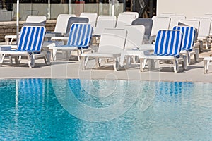 Hotel Poolside Chairs near a swimming pool