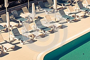 Hotel Poolside Chairs near a swimming pool