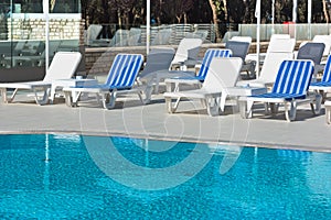 Hotel Poolside Chairs near a swimming pool