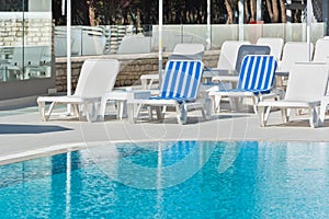 Hotel Poolside Chairs near a swimming pool