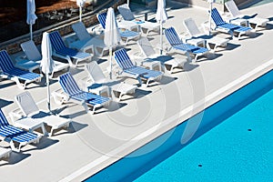 Hotel Poolside Chairs near a swimming pool