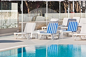 Hotel Poolside Chairs near a swimming pool