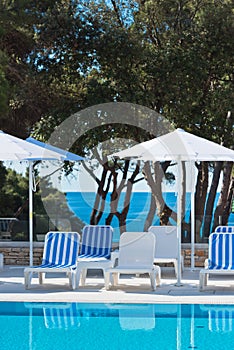 Hotel Poolside Chairs with Sea view