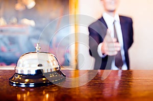 Hotel reception bell receptionist greeting handshake