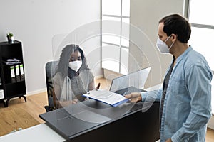 Hotel Reception Desk Protected By Medical Mask