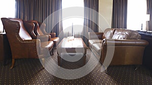 Hotel room for business meetings with leather furniture