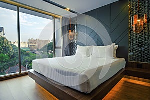 Hotel room interior, single bed for background