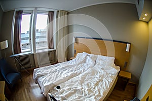 Hotel room with messed-up bed