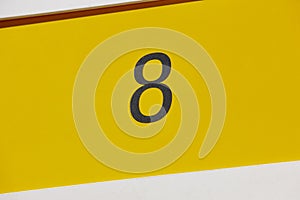 Hotel room number eight, yellow background. Tourist apartment