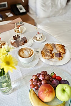 Hotel room service with fresh cappuccino