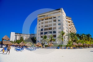 Hotel on the sandy beach on a sunny day in Cancun, Yukatan, Mexico