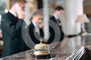 Hotel service bell Concept hotel, travel, room,Modern luxury hotel reception counter desk on background.