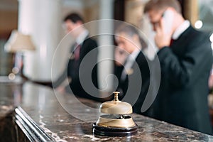 Hotel service bell Concept hotel, travel, room,Modern luxury hotel reception counter desk on background.