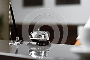 Hotel service bell on front desk counter